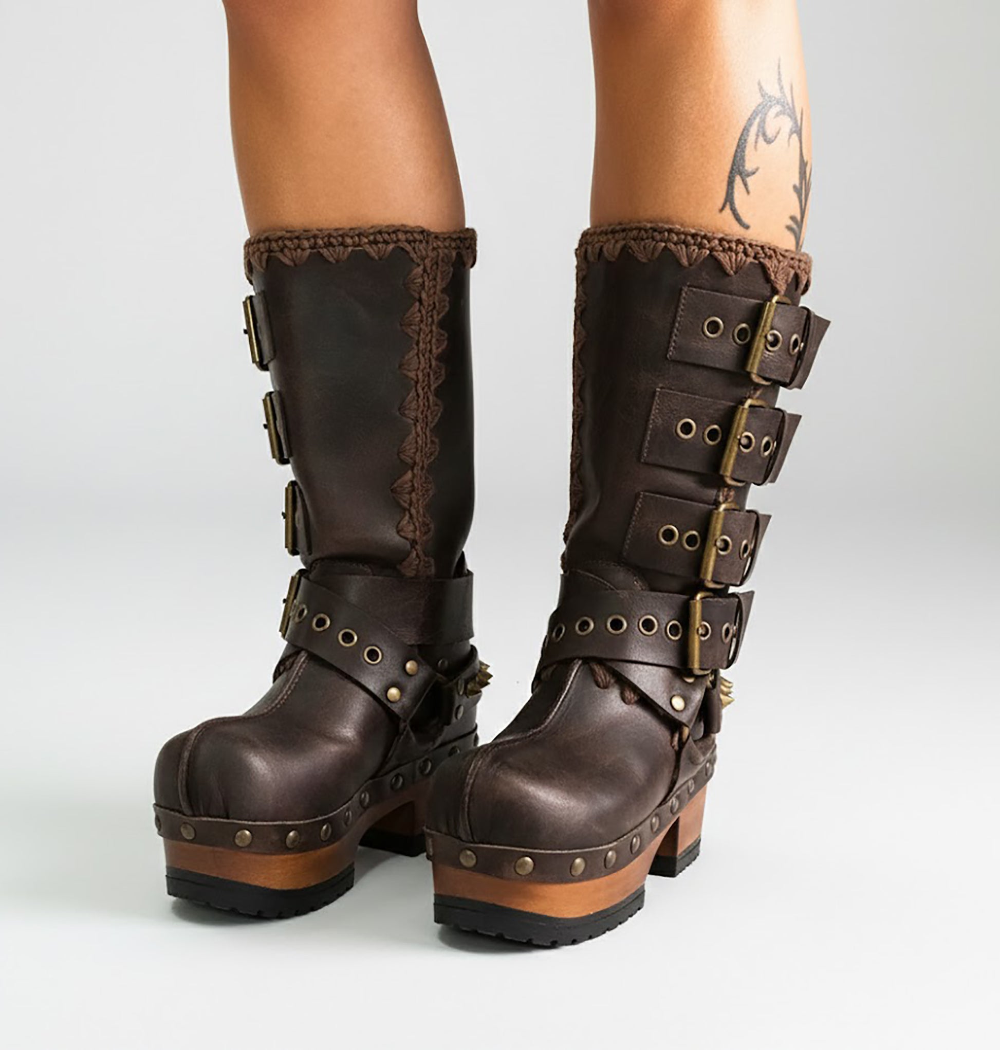 Handmade leather clogs. Dark brown leather biker boots. Leather boots with wooden heels. Leather boots with buckles. High-end footwear handmade by Sol Caleyo.