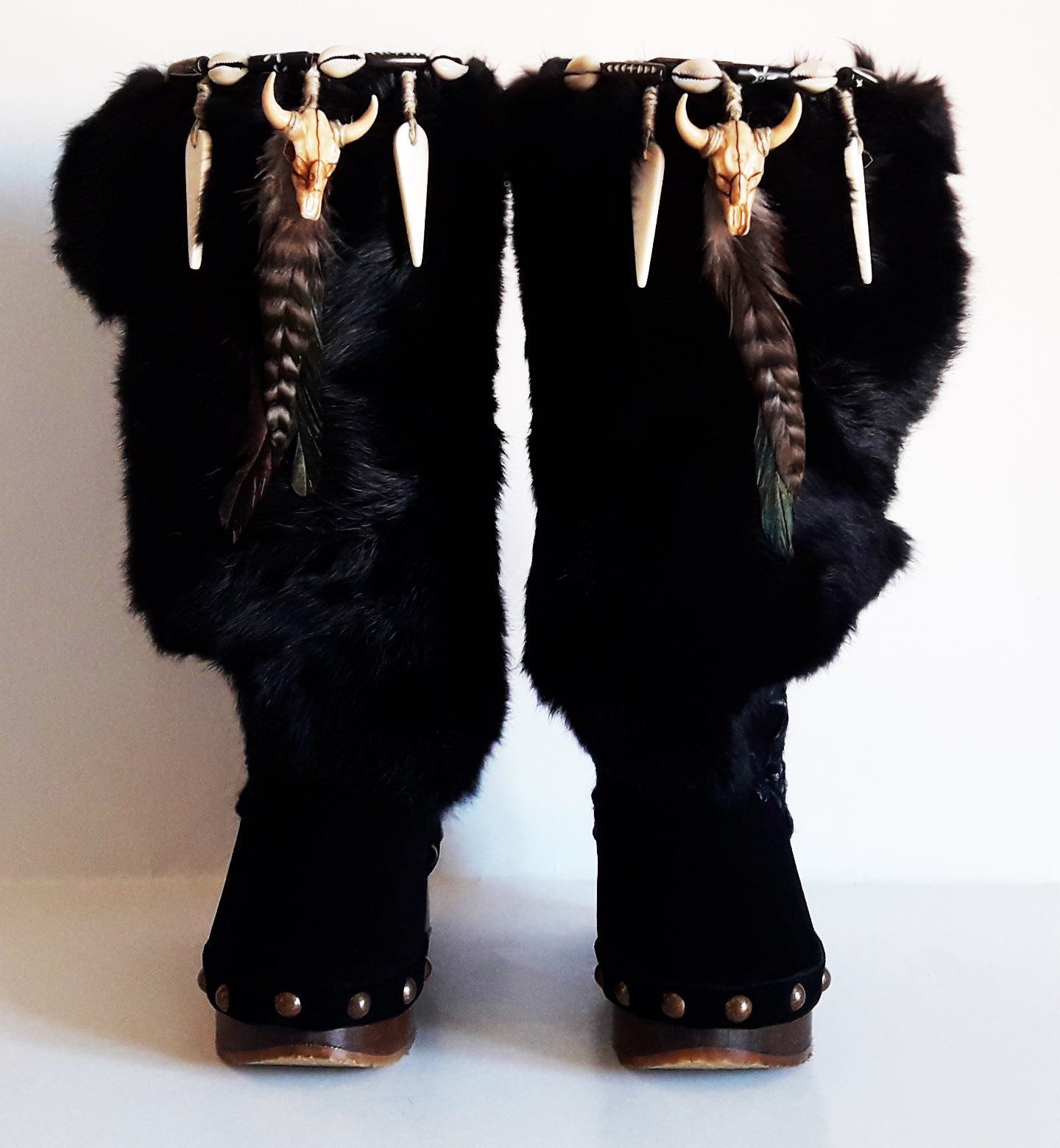 Black suede and rabbit fur clog boots. Wooden wedge boots. Rabbit fur boots with feathers, shells and horns decoration. Bohemian style boots.  Sizes 34 to 47. Handmade leather shoes of excellent quality by Sol Caleyo. 
