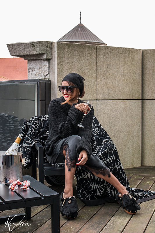 Handmade black split suede closed-toe platform mule clogs with black rabbit fur, feathers, bone, carved horn, shells and 5 cm straight natural lacquered wooden heel by Sol Caleyo.