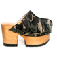 Handmade military green and brown camo print leather closed-toe platform mule clogs with round flat bronze studs and 10 cm natural lacquered wooden heel by Sol Caleyo.