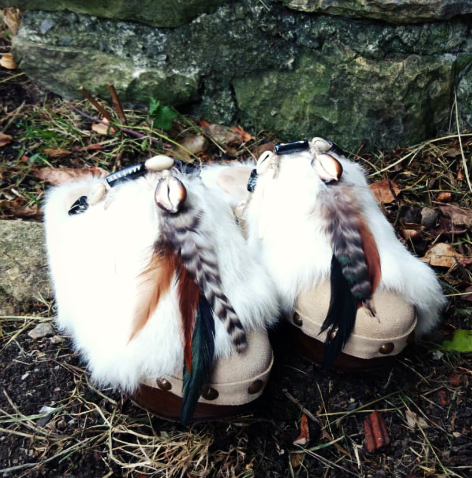 Off-white rabbit fur panel on beige suede mule clogs.