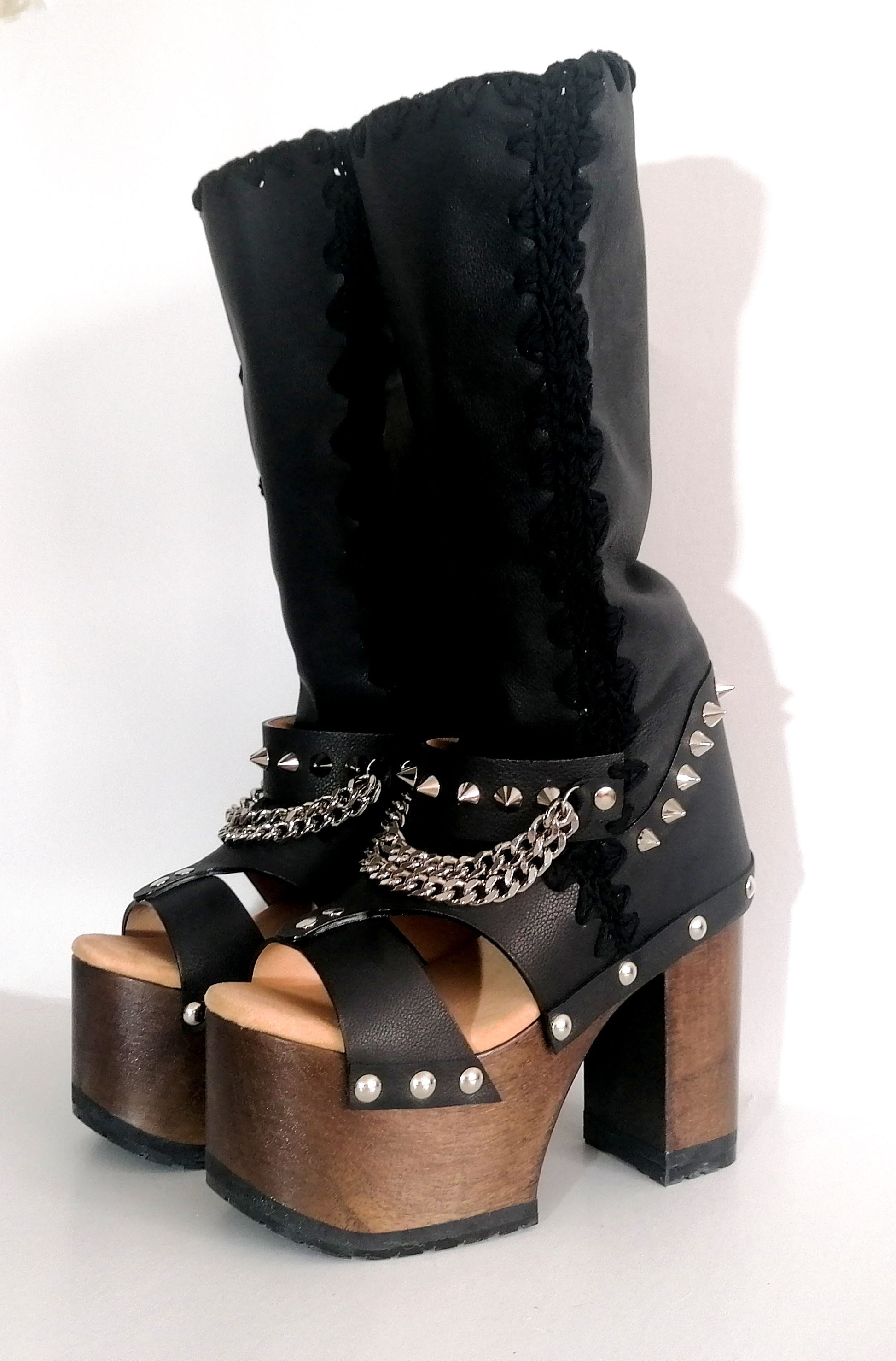 Black platform sandal with super high heel. Black super high heel platform boot with studs and silver chains. Super high heel biker style boot. Sizes 34 to 47. Handmade leather shoes by sol Caleyo.