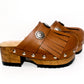 Brown platform clog vintage style 70s. Brown leather clog decorated with American Indian conchos. Leather clogs with wooden heel. Sizes 34 to 47. High quality leather shoes handmade by Sol Caleyo.