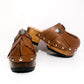 Brown platform clog vintage style 70s. Brown leather clog decorated with American Indian conchos. Leather clogs with wooden heel. Sizes 34 to 47. High quality leather shoes handmade by Sol Caleyo.