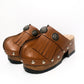 Brown platform clog vintage style 70s. Brown leather clog decorated with American Indian conchos. Leather clogs with wooden heel. Sizes 34 to 47. High quality leather shoes handmade by Sol Caleyo.