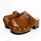 Brown platform clog vintage style 70s. Brown leather clog decorated with American Indian conchos. Leather clogs with wooden heel. Sizes 34 to 47. High quality leather shoes handmade by Sol Caleyo.