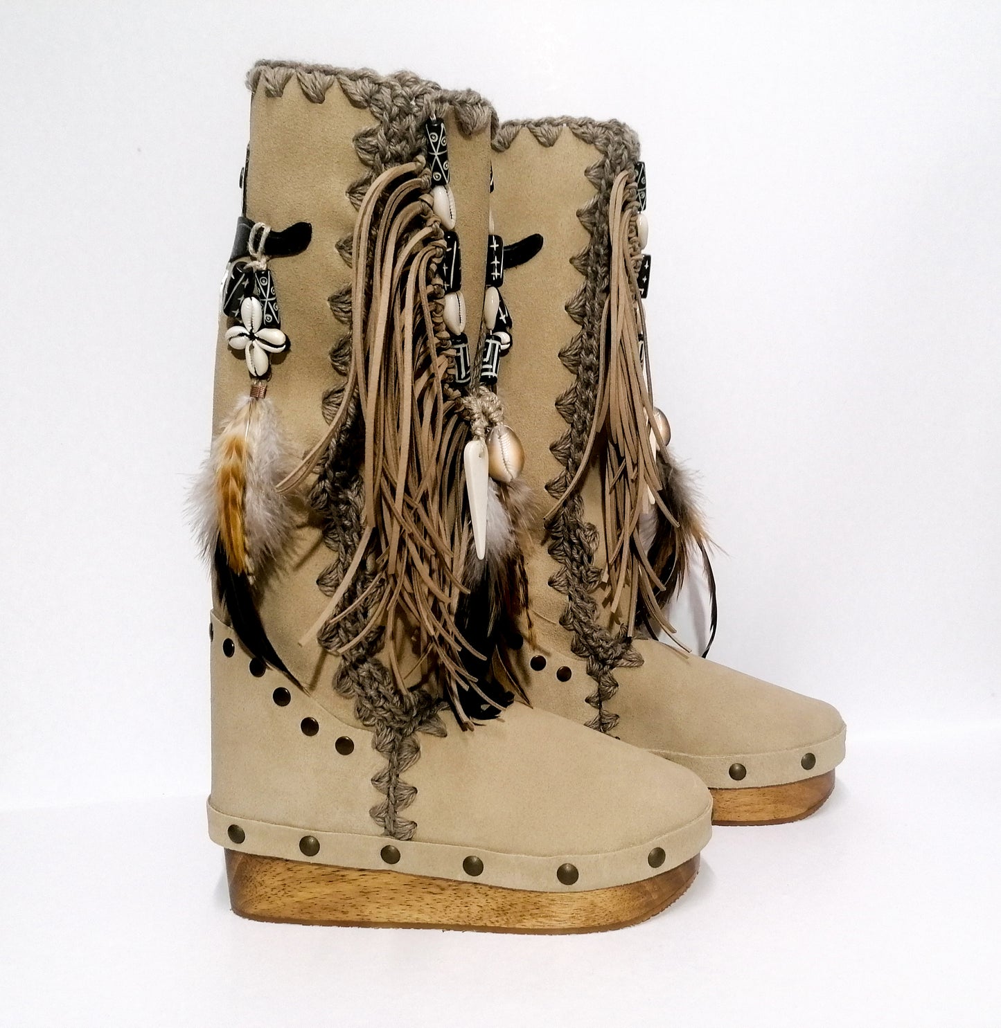 Wooden clog boot. Suede leather boot decorated with fringes, natural shells, feathers, horns and hand painted buffalo. Bohemian style boot with wooden wedge. Sizes 34 to 47. High quality leather footwear handmade by sol Caleyo. Sustainable fashion.