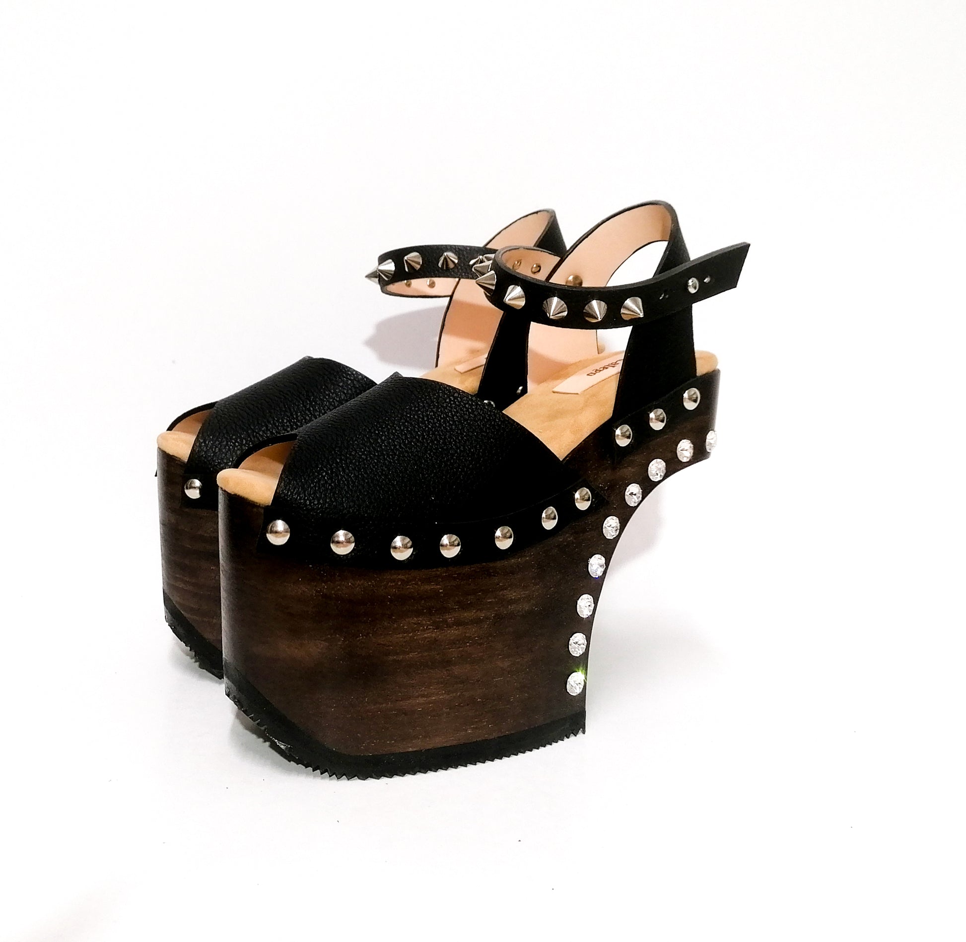 Black leather platform sandal with silver studs. Wooden wedge heel in C decorated with swarovski crystals. Super high heel sandal with genuine swarovski crystals. Super high heel sandal without heel. Sizes 34 to 47. High quality leather shoes handmade by sol Caleyo. Sustainable fashion.