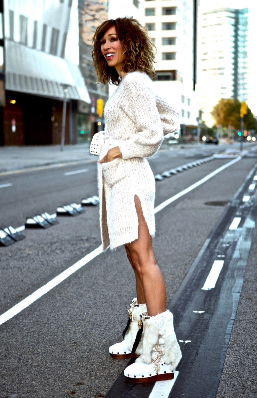 White handmade boho leather and rabbit fur wedge boots with carved bone, shells and feathers by Sol Caleyo